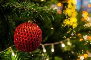 Red balls decorated with Christmas tree decorations. New year and Christmas festivals. Copy space background. photo