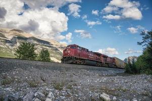 Canadian Pacific railway long freight transport passing in the valley photo
