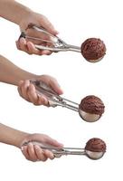 Hand holding chocolate ice cream in spoon for scoop on white background photo