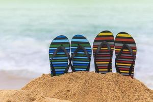 Flip flops on the sandy beach photo