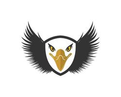 Shield with spread wings and eagle head inside vector