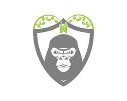 Angry gorilla inside the shield and nature leaf vector