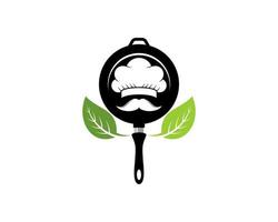 Frying pan with chef hat and nature leaf vector