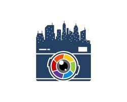 Modern camera with rainbow lens and building vector