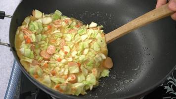 homemade making Okonomiyaki or Japanese pizza on pan video