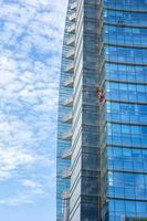 Climbing with mountaineering cords for jobs at risk of cleaning glazed office buildings photo