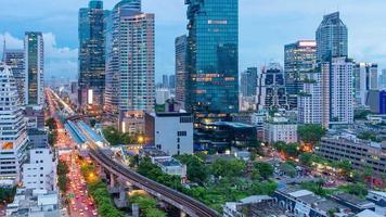 Timelapse day to night traffic during rush hour in business area at Bangkok,Thailand.Bangkok is the most populated city in Southeast Asia. video