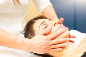 A relaxing facial massage in an aesthetic study photo