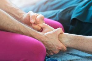 Massager with the finger of the hand stretching photo