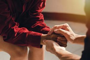 Christian couples holding hands and praying together To give good encouragement to each other photo