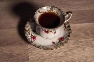 Composición taza de galletas de té con azucarero foto