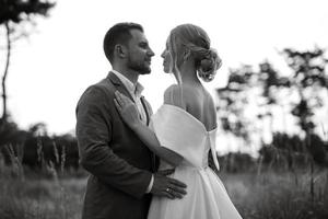 bride and groom on in the woods photo