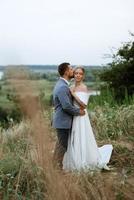 bride and groom on in the woods photo