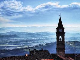 the church of Govone, in Piedmont, in the main square with the beautiful panorama of the Roero hills behind it photo