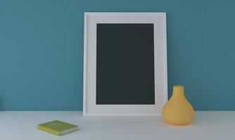 3D rendering of a blank frame mockup next to a vase and book leaning against a blue wall photo