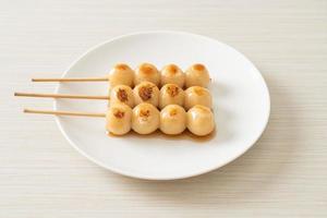 Mitarashi dango. Dumpling in a sweet soy sauce photo