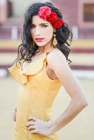 Woman, model of fashion, wearing a dress in a bullring photo