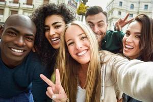 Multiracial group of young people taking selfie photo