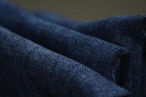 Dark blue jeans close up, Close up shot of denim jeans photo