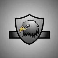 cabeza de águila y escudo logo esport vector