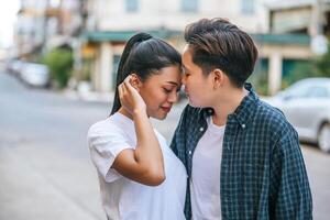 Women couples stand and fragrant cheek. photo