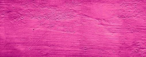 Fondo de textura de pared de hormigón abstracto de color sólido rosa púrpura foto