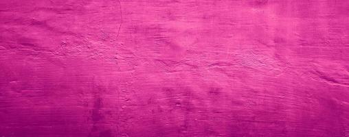 Fondo de textura de pared de hormigón abstracto de color sólido rosa púrpura foto