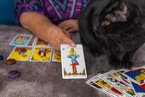 woman casting tarot cards photo