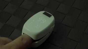 Finger pulse oximeter used to measure pulse rate and oxygen video