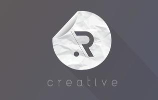 R Letter Logo with Crumpled And Torn Wrapping Paper Texture. vector