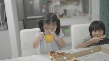 Children eating pizza party deliciously video