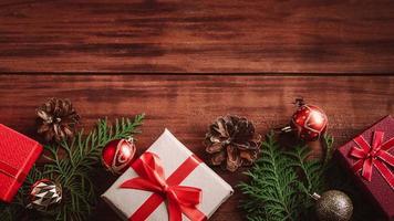 Merry Christmas Beautiful gift boxes and fir branches on wooden background. video