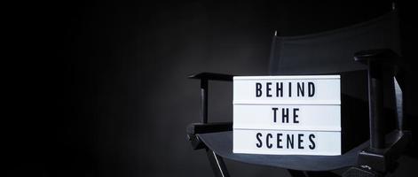 Director chair with behind the scene banner light box. photo