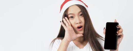 Asian woman with smartphone in hand which posing like selfie or video call photo