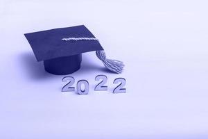 Gift box in the form of a graduation cap. 2022 release concept on very peri  background copy space photo