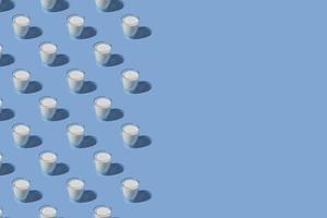 World Milk Day. Pattern on a blue background. A glass of milk. Sample. With space for text. copy space photo