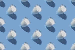 World Milk Day. Pattern on a blue background. A glass of milk. Pattern. photo