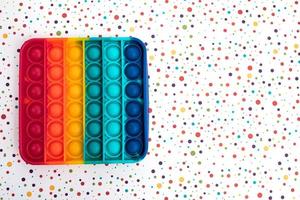 Fidget pop it toy rainbow color, antistress, fun and educational photo