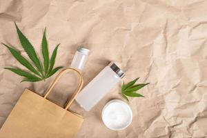 cosmetics with marijuana plant extract anti-aging cosmetic body care products with marijuana leaves copy space photo
