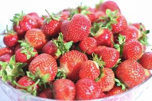 fresh garden grown strawberry in a large bowl. direct sunlight. garden berries, vitamin and antioxidants. photo