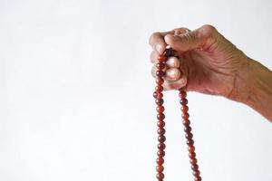 Close up of senior women hand praying at ramadan photo