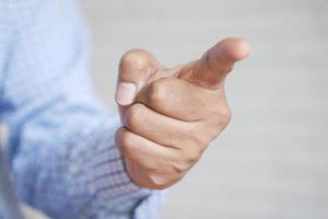 young businessman in suit point finger at camera, photo