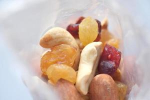 packet of mixed nuts on table photo