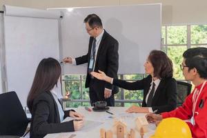 Team business meeting or workshop for development company investment real estate photo