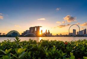 Urban downtown business buildings area at sunset in Singapore.Singapore is a world famous tourist city. photo