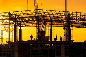 Workers busy operate at Construction site in beginning of building new complex infrastructure project. photo