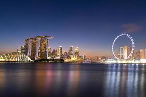Panorama view of business downtown building area during twilight time at Singapore. photo