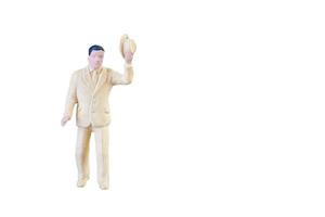 Close up of Miniature people isolated with clipping path on white background. photo