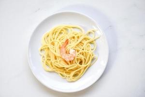 Fresh spaghetti italian pasta served on white plate spaghetti food and menu seafood concept photo