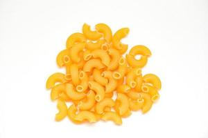 macaroni top view on white background - close up raw macaroni uncooked delicious pasta or penne noodles photo